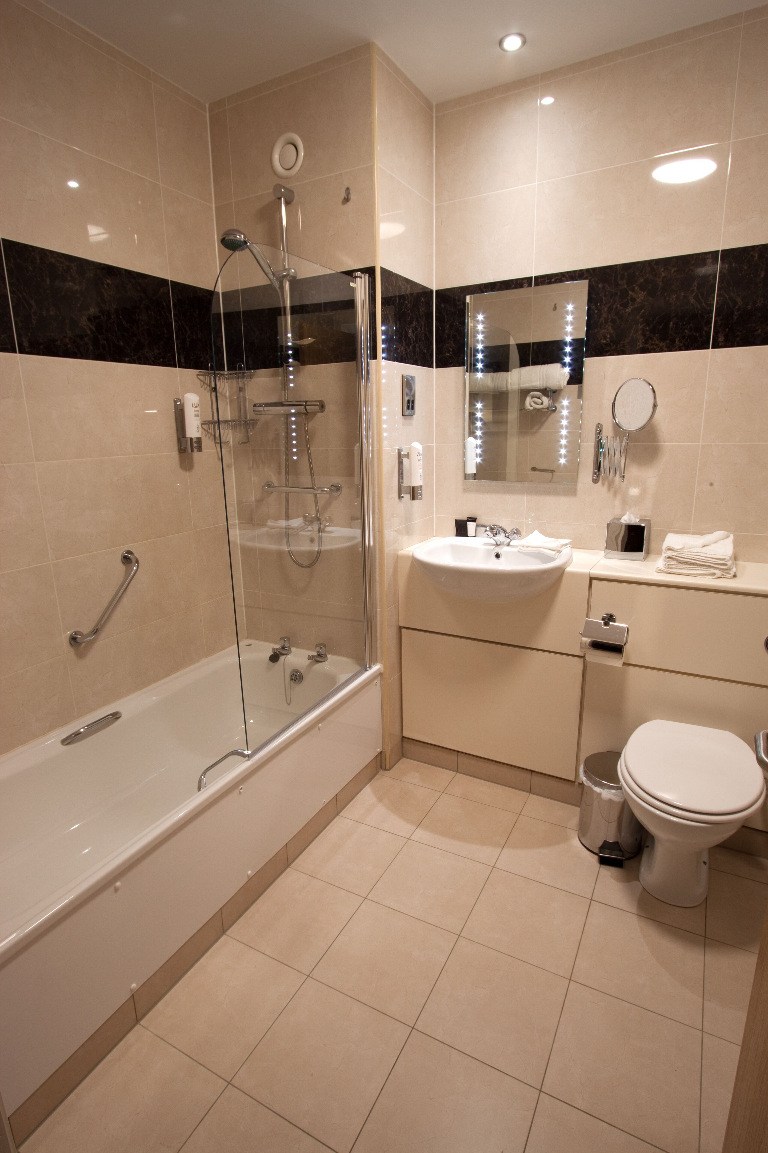 combined shower/bathtub, free toiletries, hair dryer, slippers