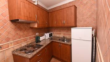 Apartment, 1 Bedroom | Private kitchen | Fridge, microwave, stovetop, coffee/tea maker