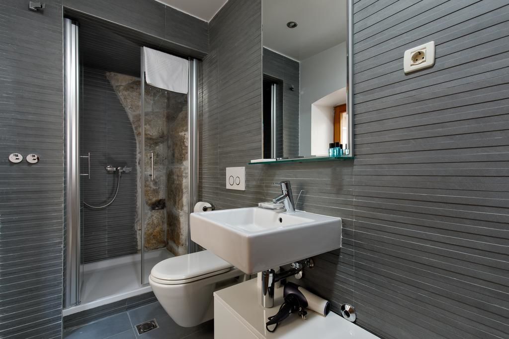 shower, hair dryer, bathrobes, slippers