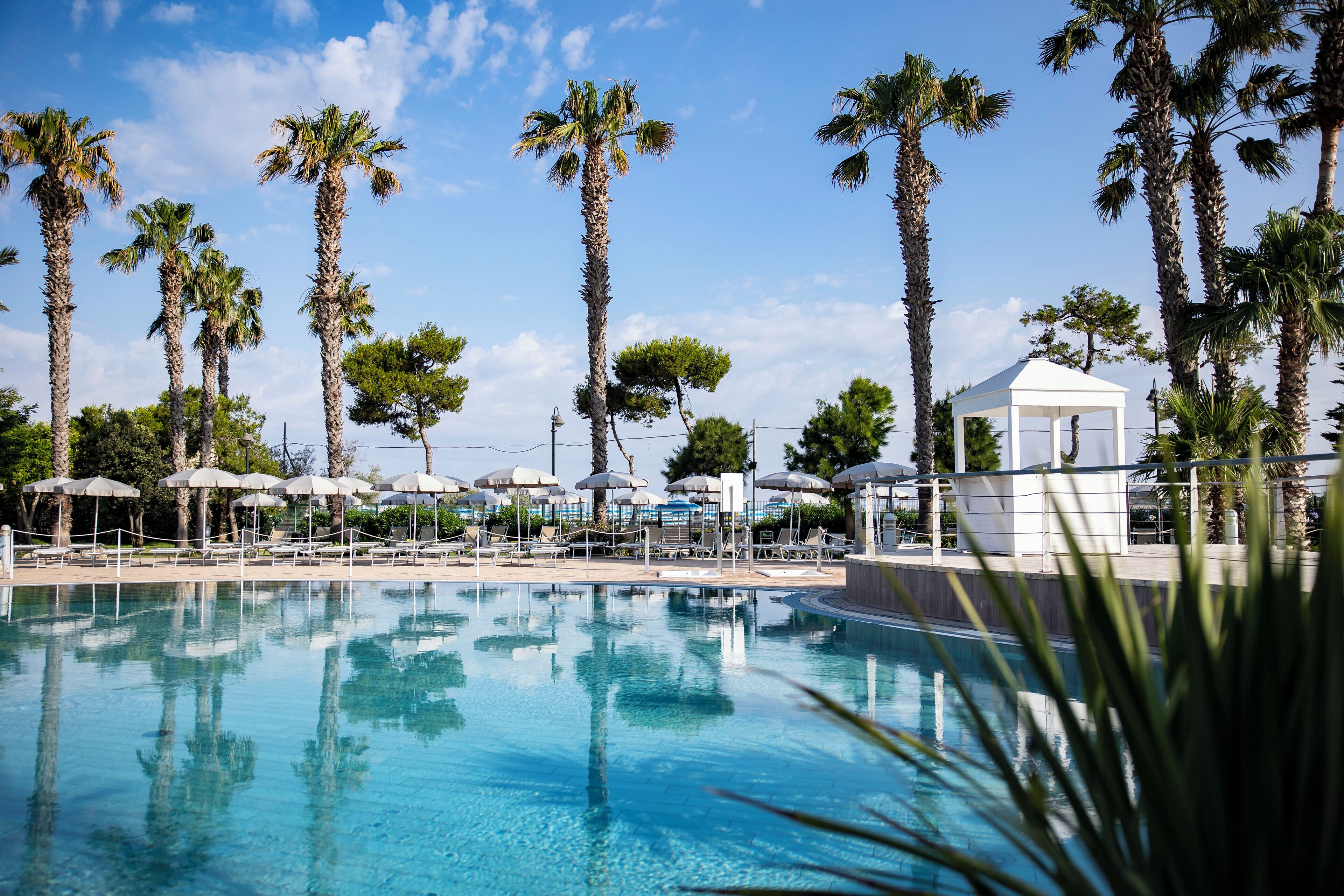 outdoor pool, pool umbrellas, pool loungers