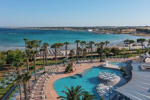 A resort with a large pool, beach, and ocean views. - Blu Salento Village (Nardò)