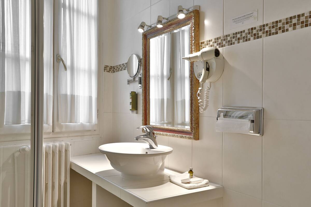 twin room, river view | bathroom | free toiletries, hair dryer, towels