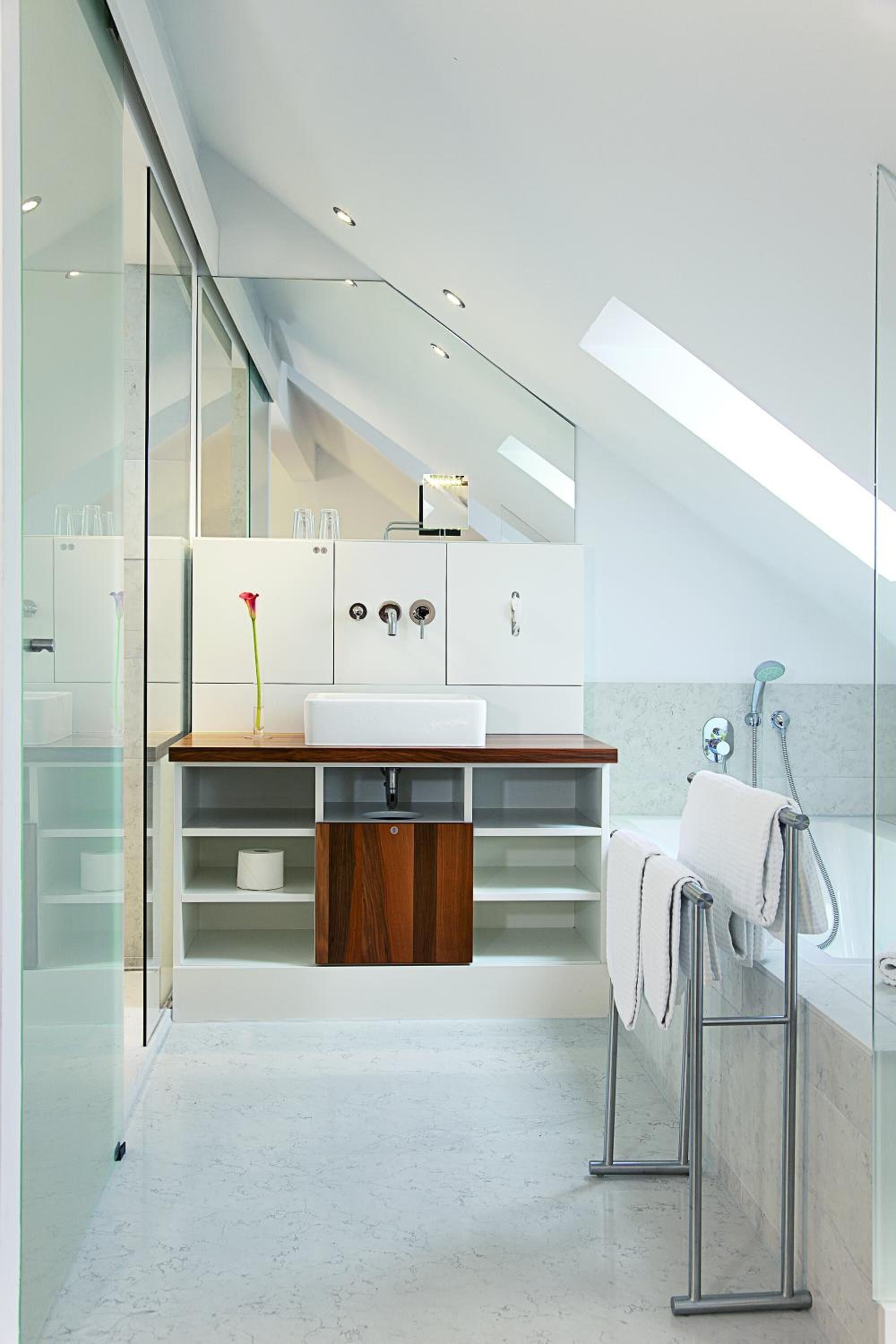 junior suite, 1 king bed, refrigerator (cozy sitting corner) | bathroom | shower, hair dryer, towels