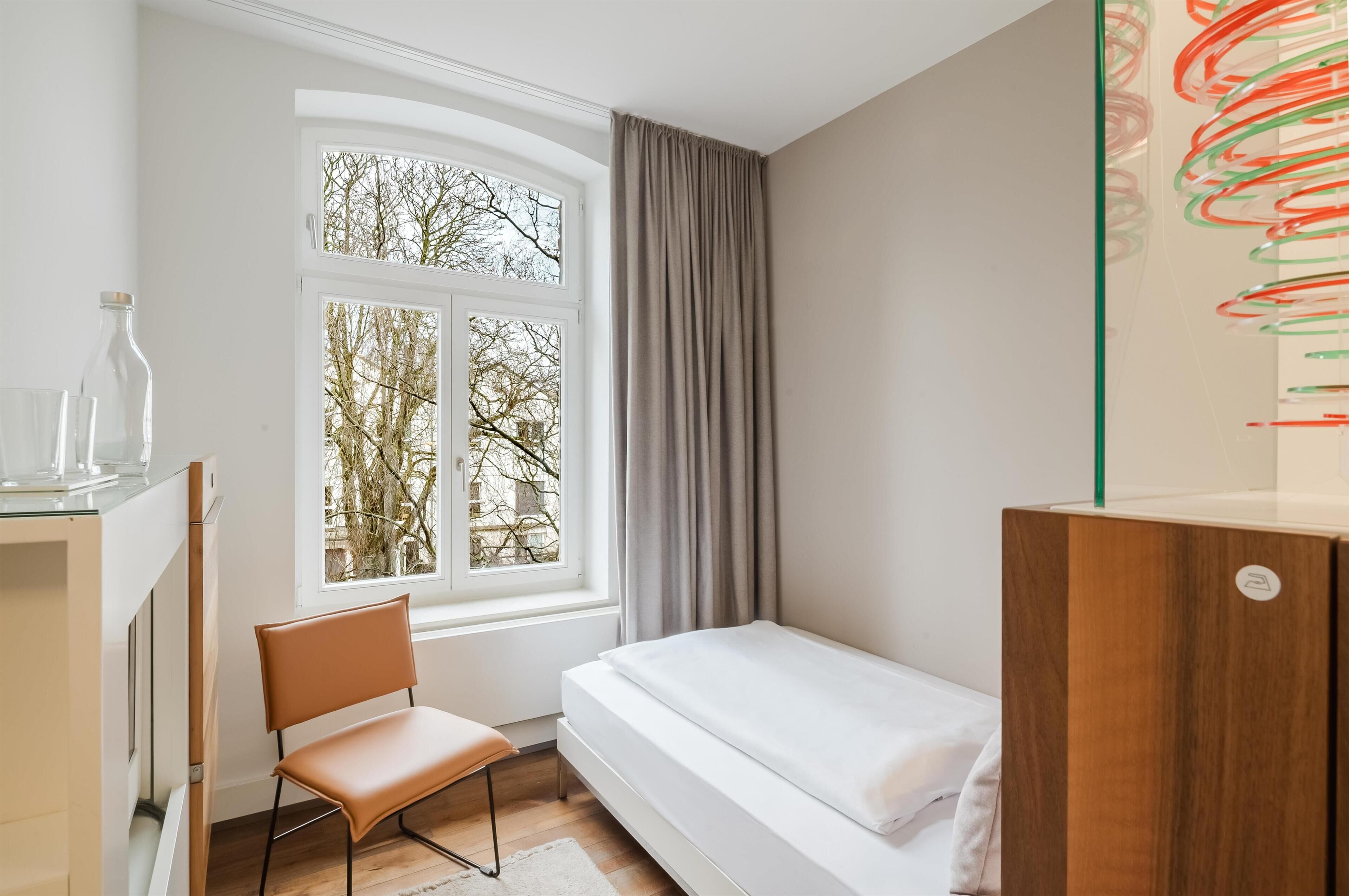 Economy Room, 1 Twin Bed, Refrigerator, Courtyard Area (Shower Only) | Premium bedding, pillowtop beds, minibar, in-room safe