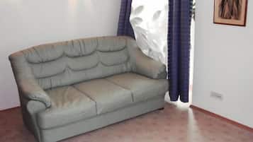 Deluxe Apartment | Living room | 80-inch LED TV with cable channels, TV