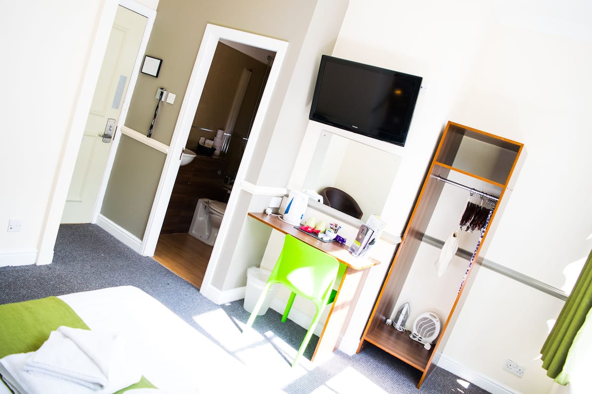 Desk, iron/ironing board, cribs (free), WiFi (free)