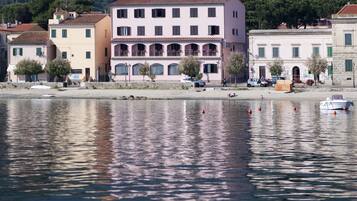 Stunning waterfront architecture with traditional Mediterranean-style buildings along the river's edge.
