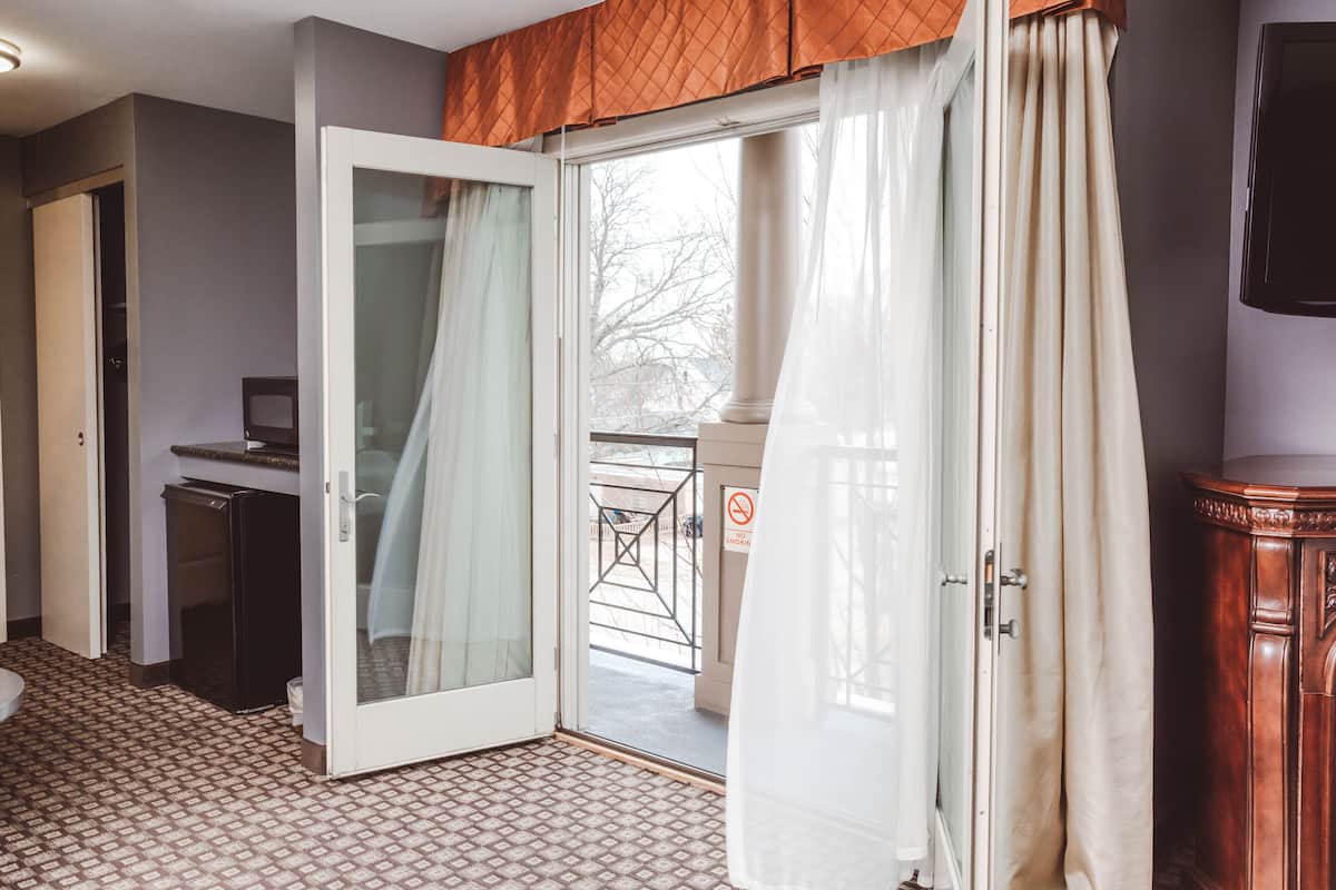 Premium bedding, desk, laptop workspace, blackout drapes