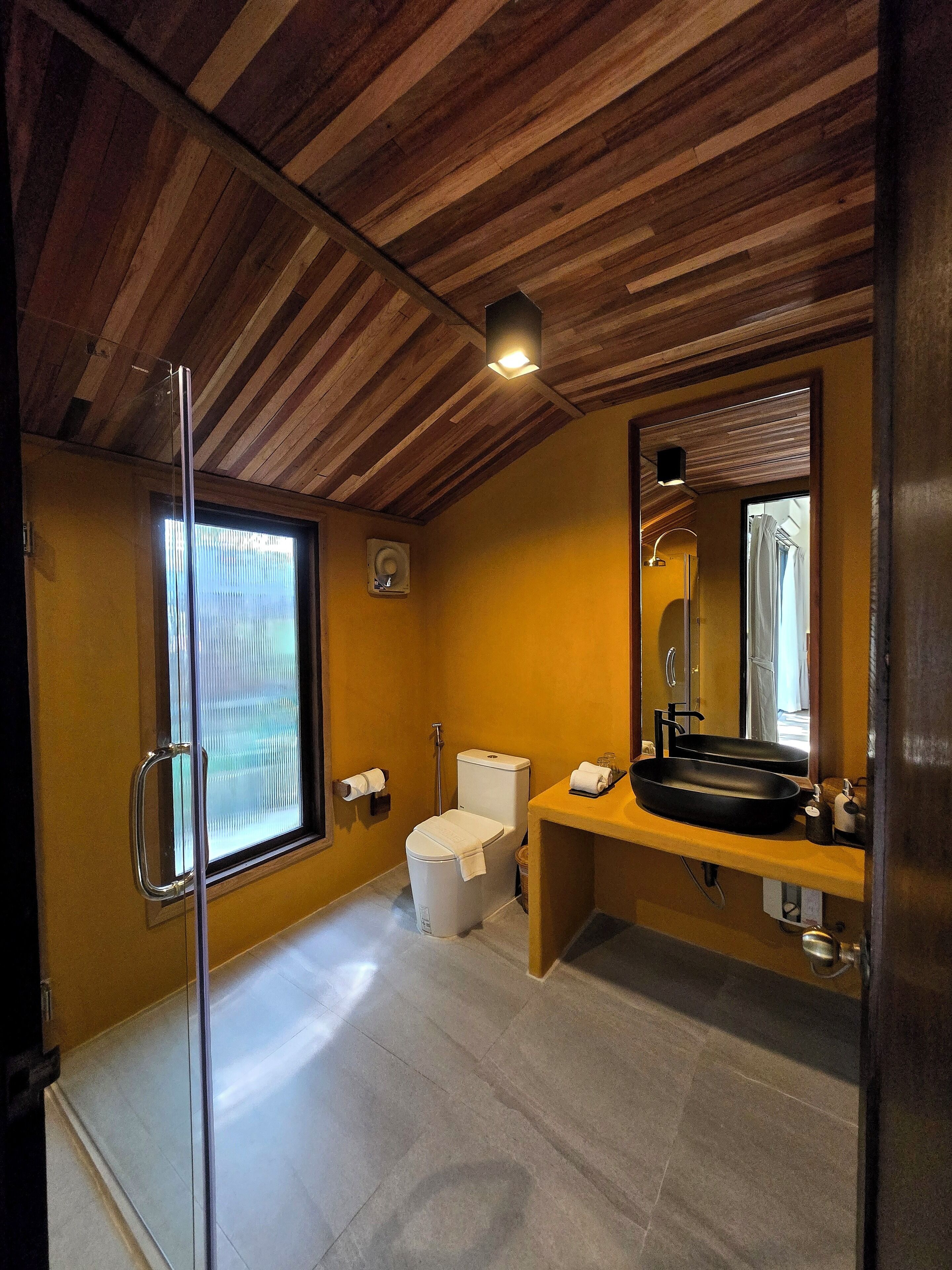 rice field family villa | bathroom | deep-soaking bathtub, rainfall showerhead, free toiletries, hair dryer