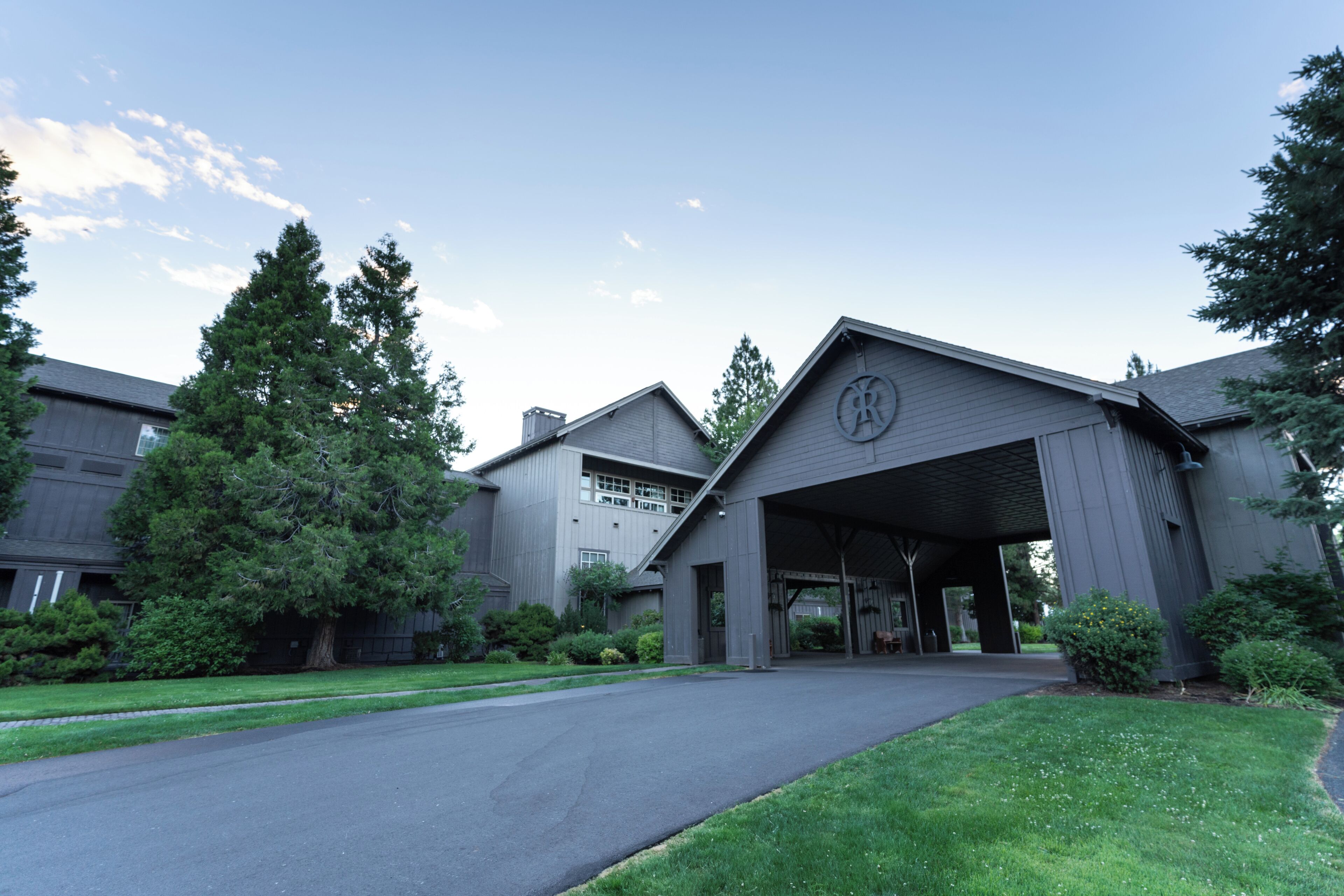 A building with a covered entrance and a garage.
