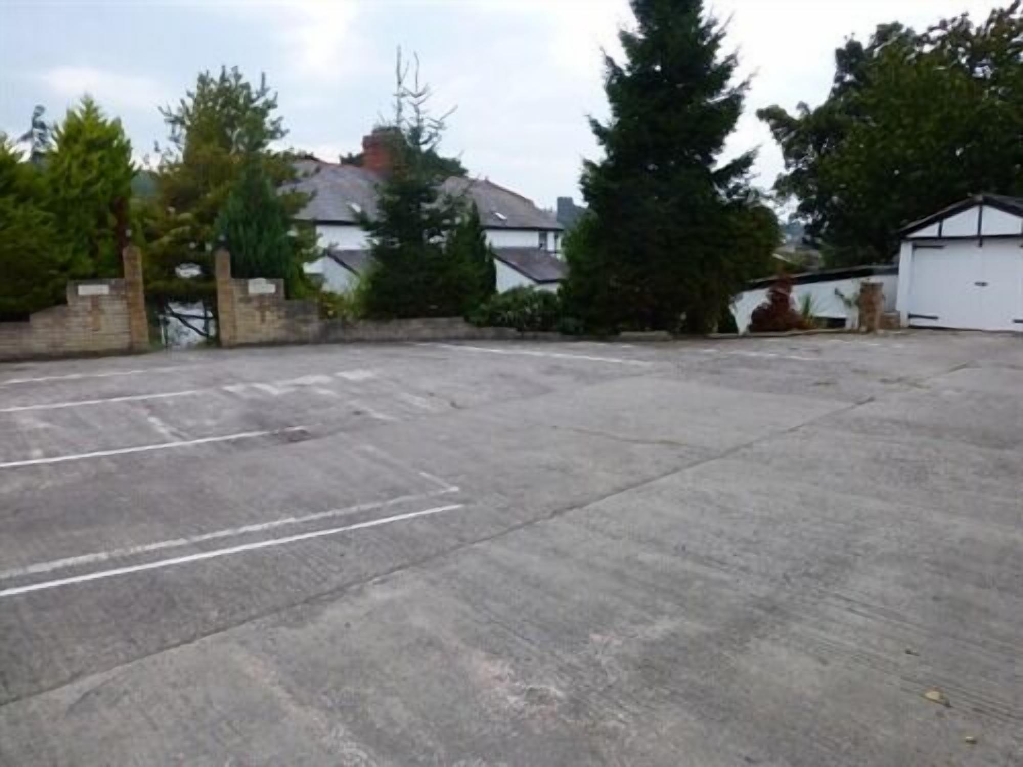 A large, open concrete parking area with no visible buildings or structures.