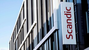 A building facade with a sign reading "Scandic."