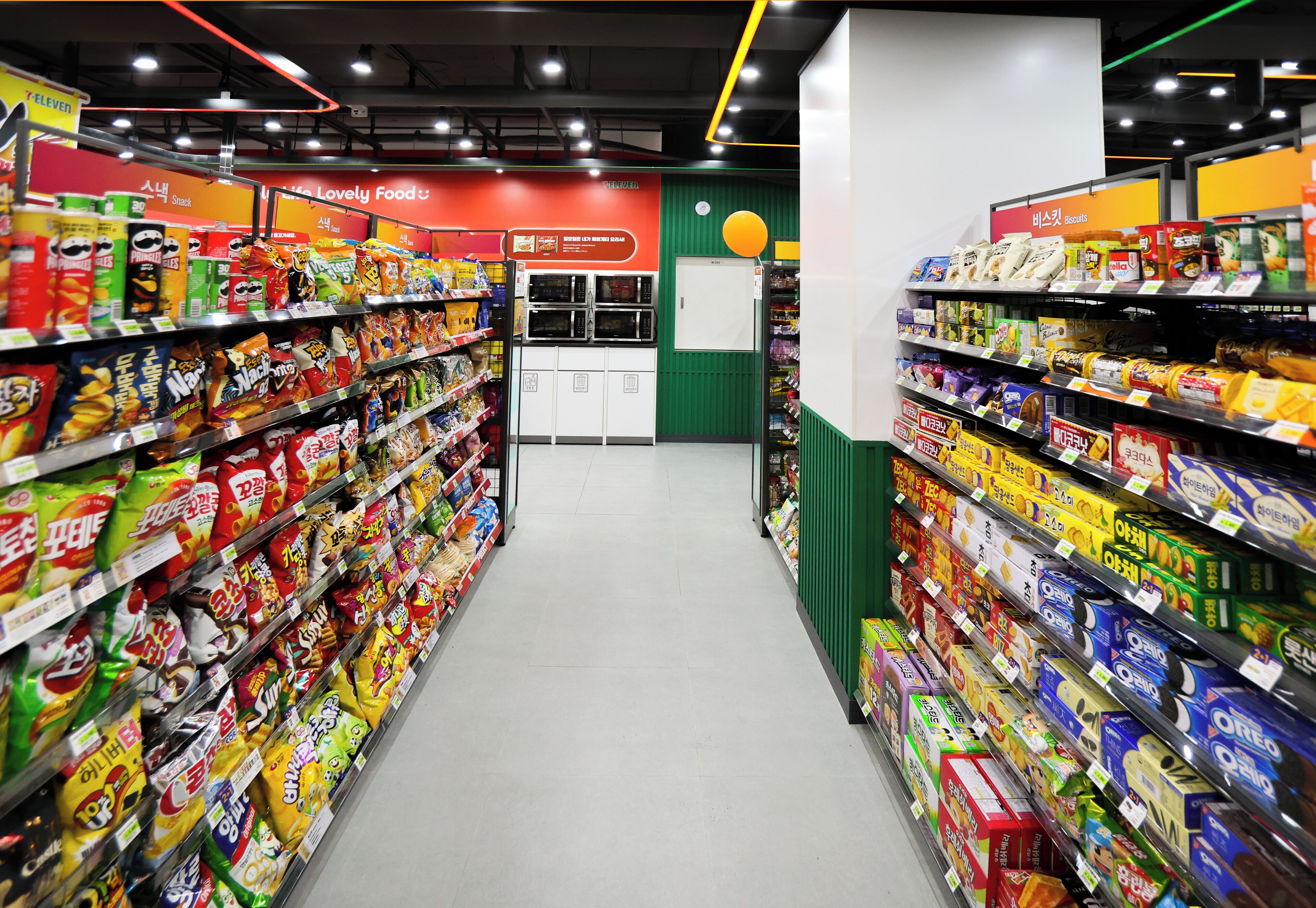 A grocery aisle with shelves stocked with various snacks and packaged goods.