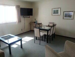 Two Bedroom Spa Suite | Living room | 40-inch LCD TV with satellite channels, TV, DVD player - Tuscany Villas Rotorua (Rotorua)