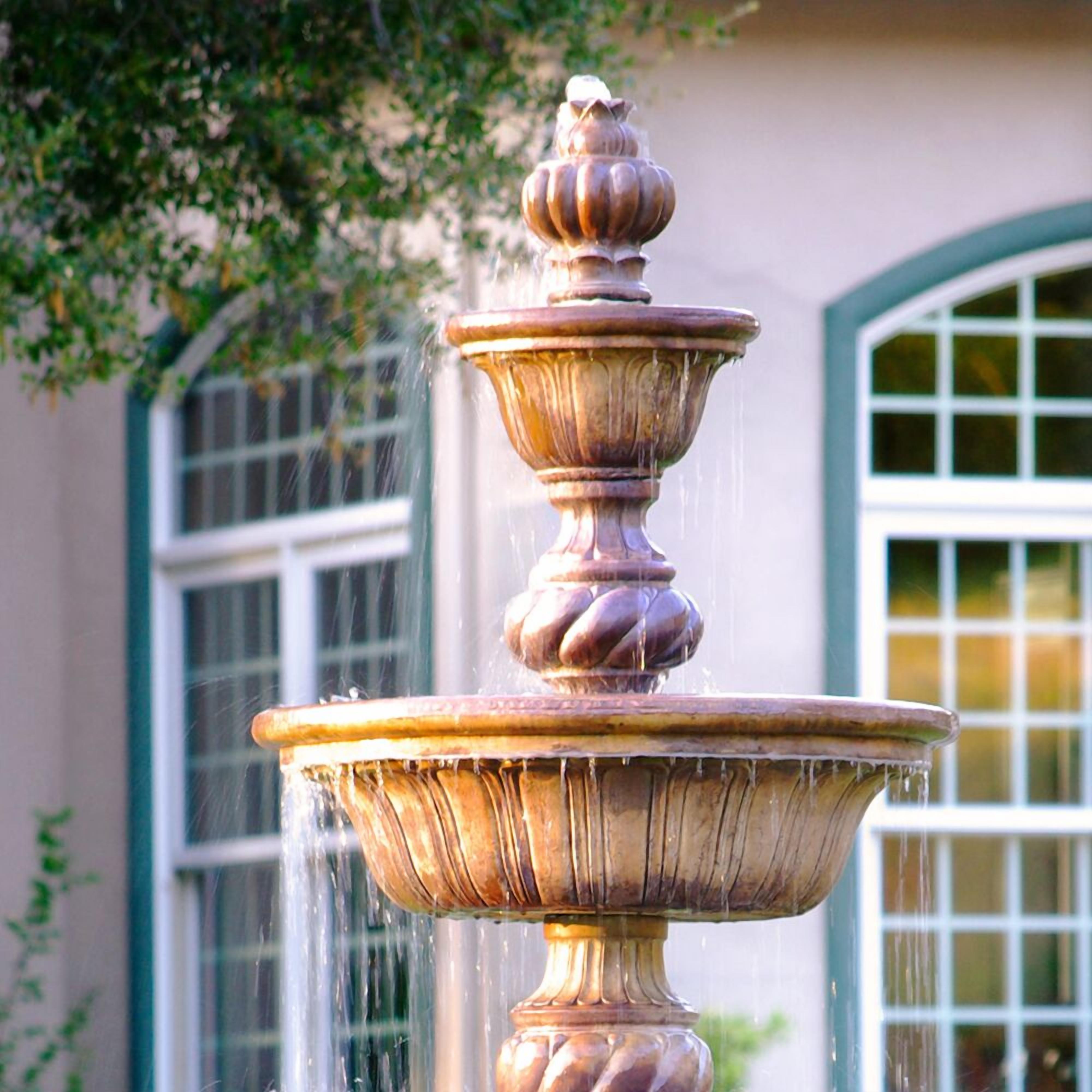 A multi-tiered fountain with water flowing from the top tier.