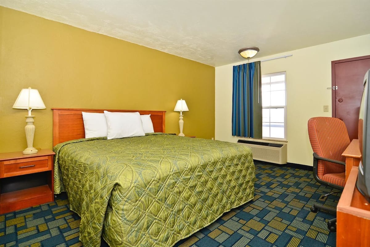 Desk, bed sheets, alarm clocks
