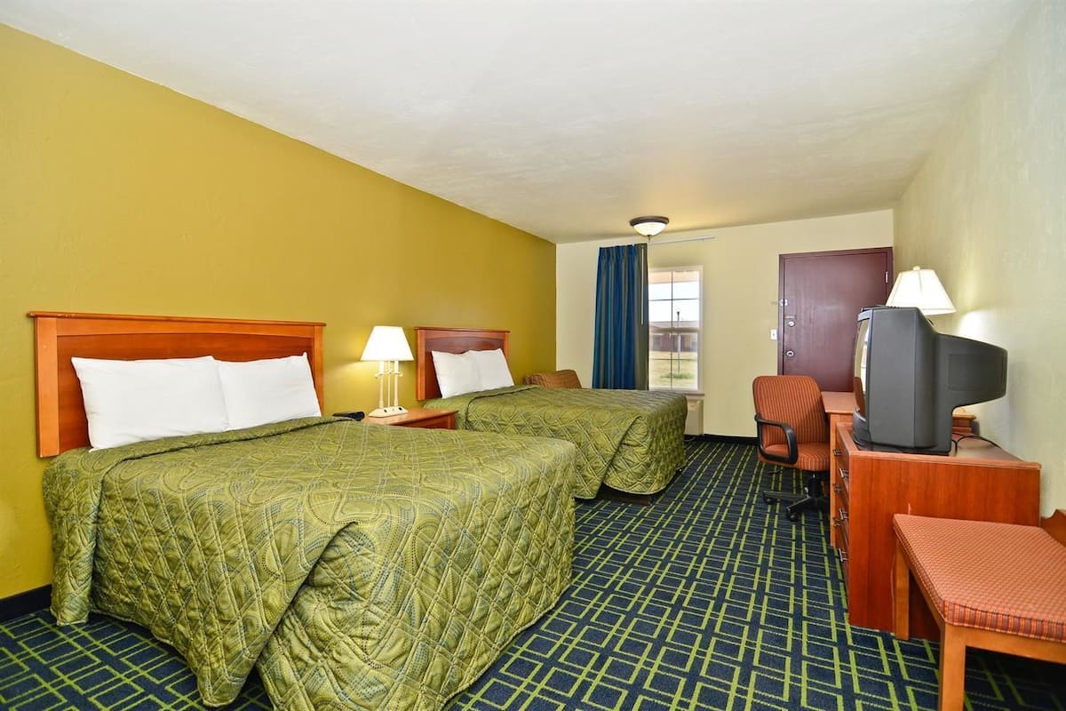 Desk, bed sheets, alarm clocks