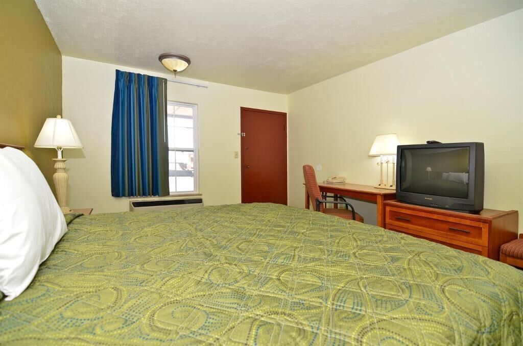 Desk, bed sheets, alarm clocks