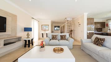 Villa Premier | Living area | 43-inch flat-screen TV with cable channels, TV