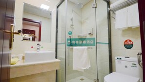 A hotel bathroom with a glass-enclosed shower, a sink, and a toilet. - Greentree Jiangsu Yizheng East Zhenzhou (Yangzhou)