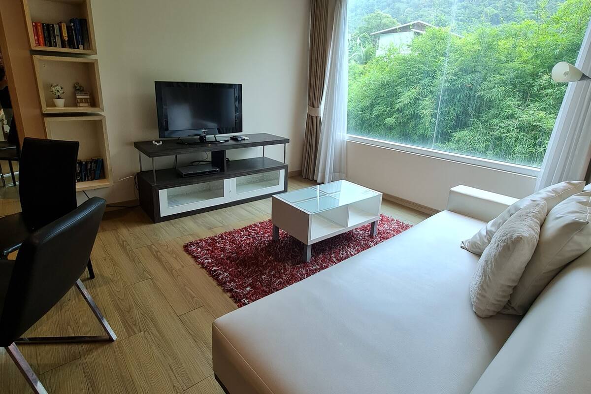 Suite, 1 Bedroom, Garden View | Living area | Flat-screen TV