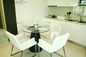 Suite, 2 Bedrooms, Garden View | Private kitchenette | Fridge, stovetop, electric kettle, dining tables - The Baycliff Residence (Patong)
