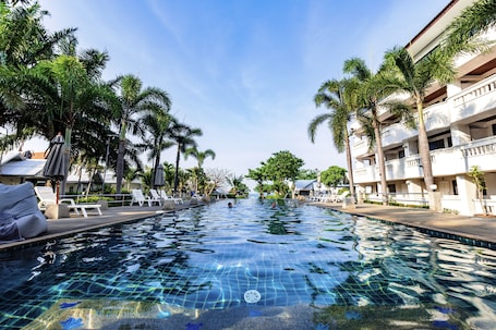 Outdoor pool, open 7:00 AM to 7:00 PM, pool umbrellas, pool loungers. Bay Beach Resort