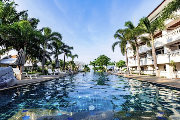 Outdoor pool, open 7:00 AM to 7:00 PM, pool umbrellas, sun loungers