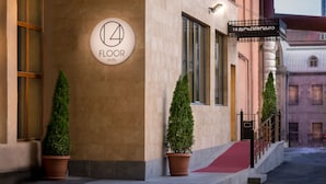 A hotel entrance with a sign indicating the 14th floor. - 14 Floor Hotel (Yerevan)