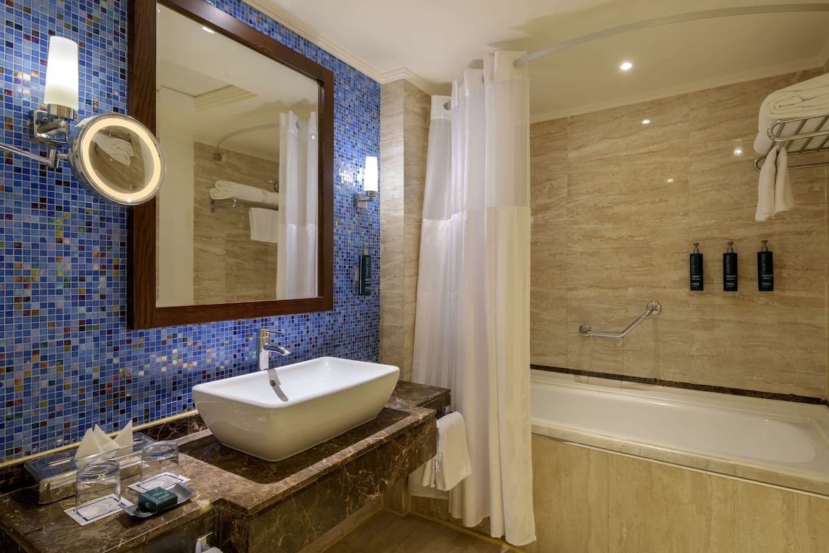 twin room, pool view | bathroom | shower, free toiletries, hair dryer, bathrobes