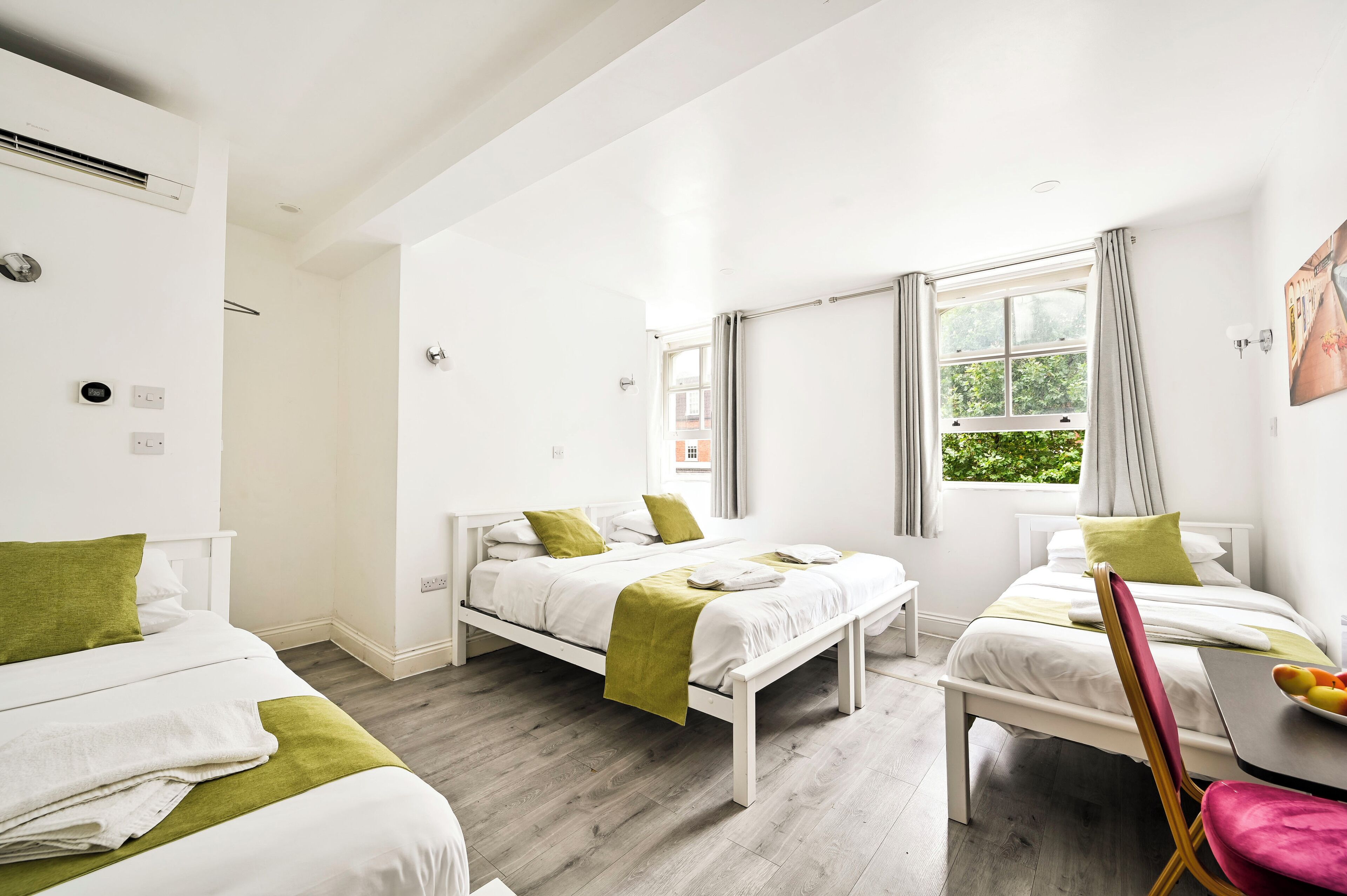 Quadruple Room, Private Bathroom | Pillow-top beds, in-room safe, iron/ironing board, free WiFi