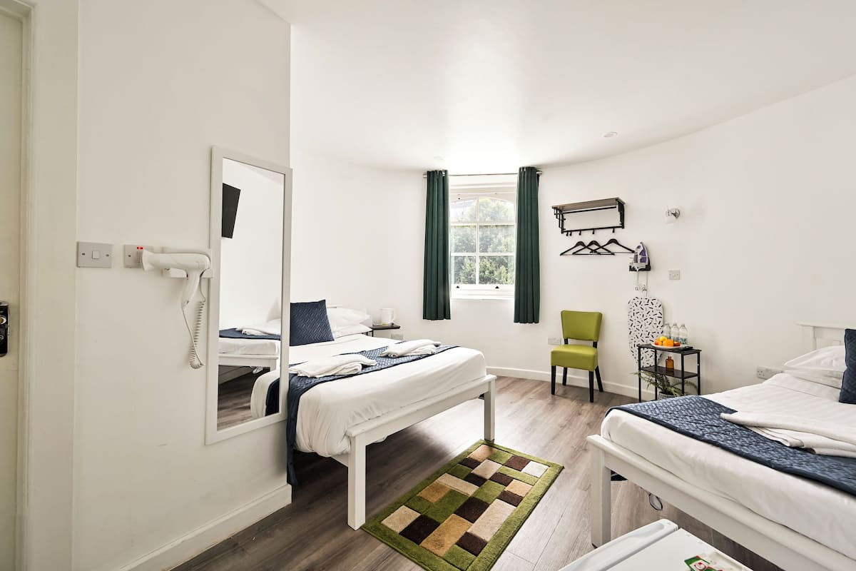 Family Room | Pillow-top beds, in-room safe, iron/ironing board, free WiFi