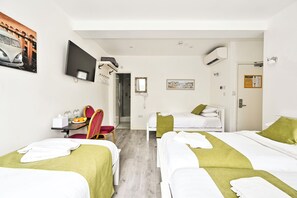 Quadruple Room, Private Bathroom | Pillow-top beds, in-room safe, iron/ironing board, free WiFi