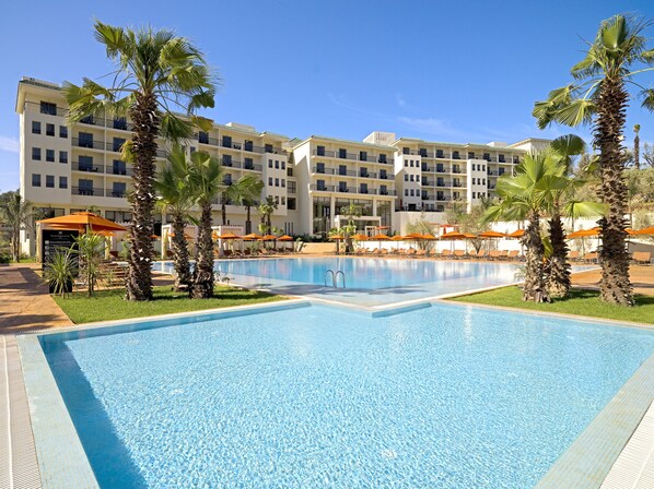 Indoor pool, outdoor pool, pool umbrellas, sun loungers