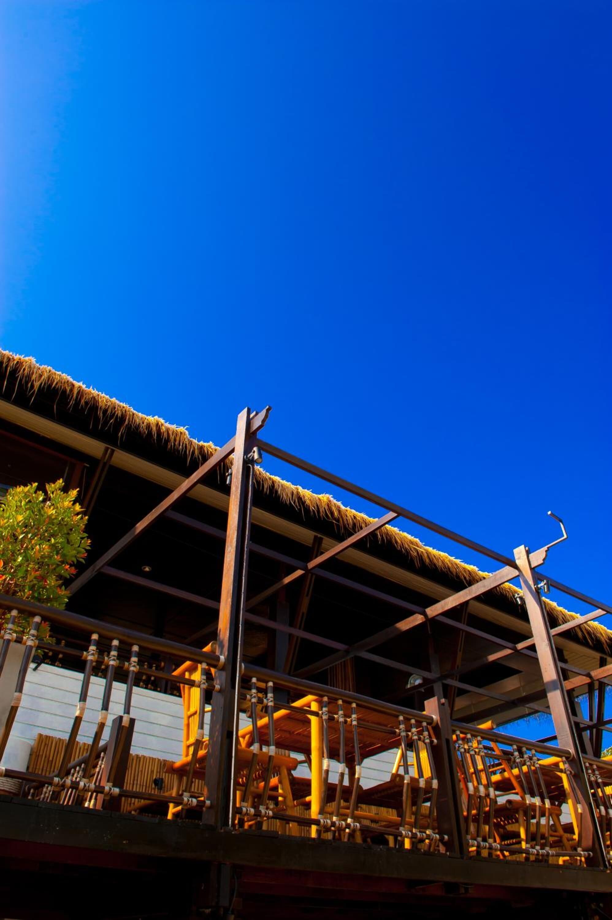 A building with a thatched roof and wooden beams.