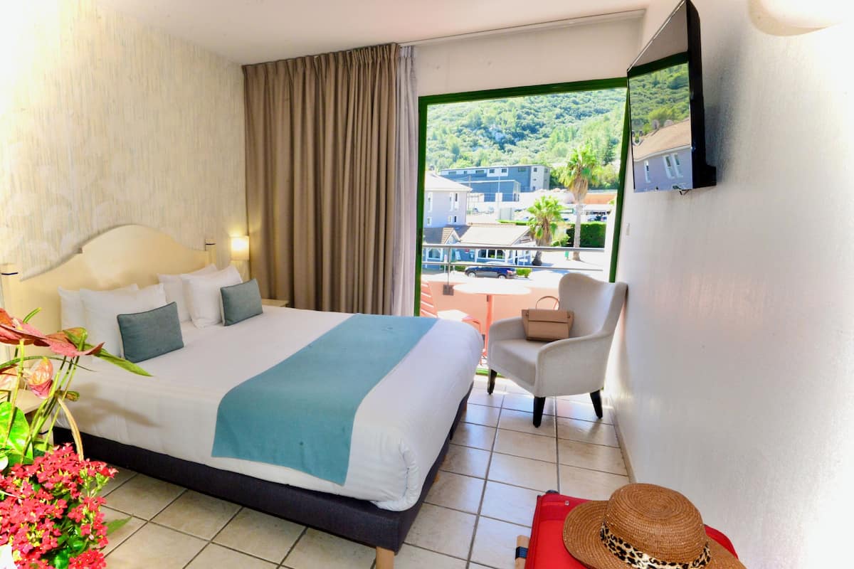 comfort room, 1 queen bed, non smoking, terrace | desk, laptop workspace, iron/ironing board, free wifi