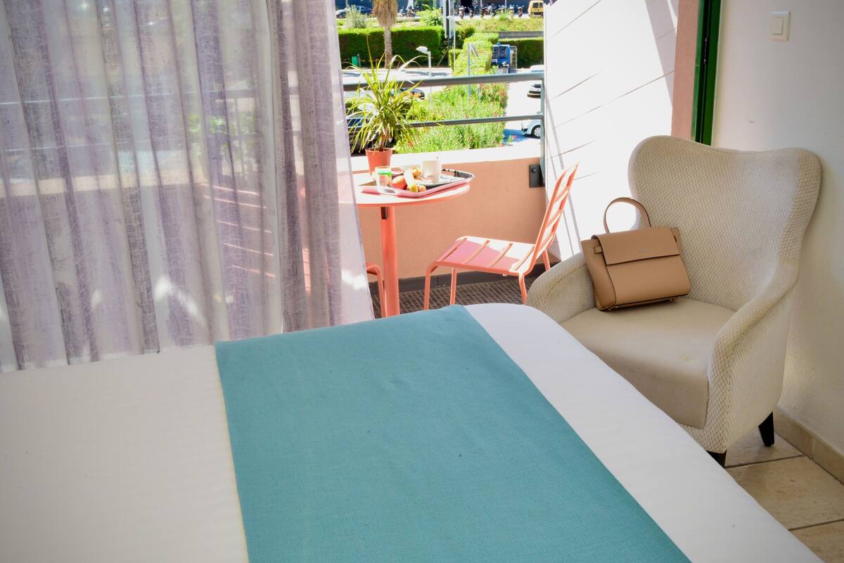 comfort room, 1 queen bed, non smoking, terrace | desk, laptop workspace, iron/ironing board, free wifi