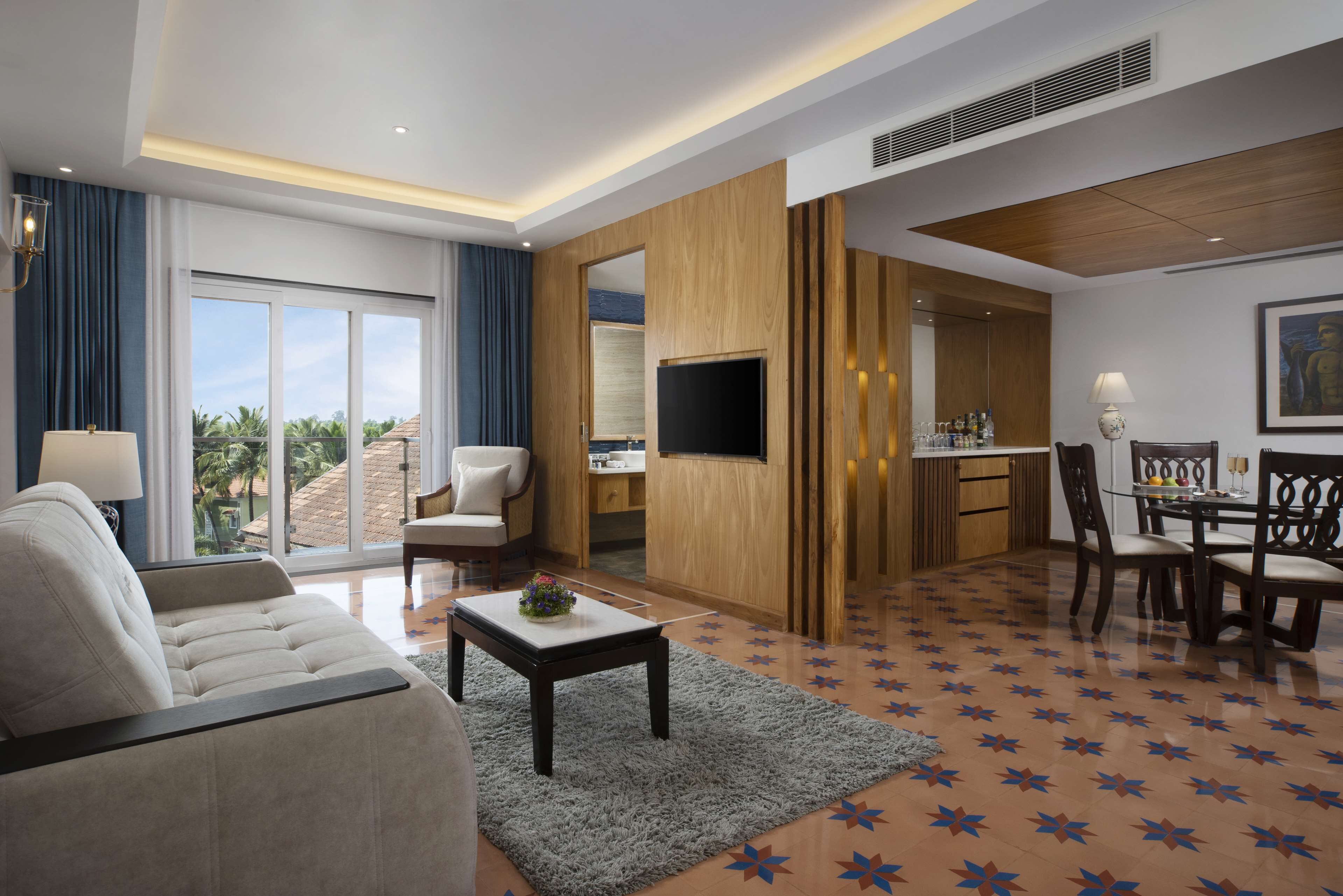 Luxury Suite with Living Room and Balcony ( Partial Garden View ) | Minibar, in-room safe, desk, laptop workspace