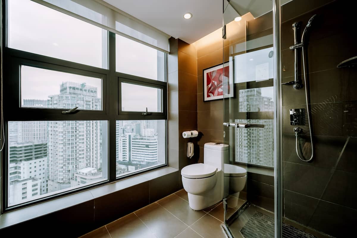 deluxe cityview room | bathroom | eco-friendly toiletries, hair dryer, bathrobes, slippers