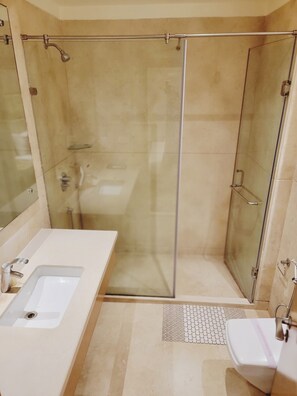 Shower, designer toiletries, hair dryer, bathrobes