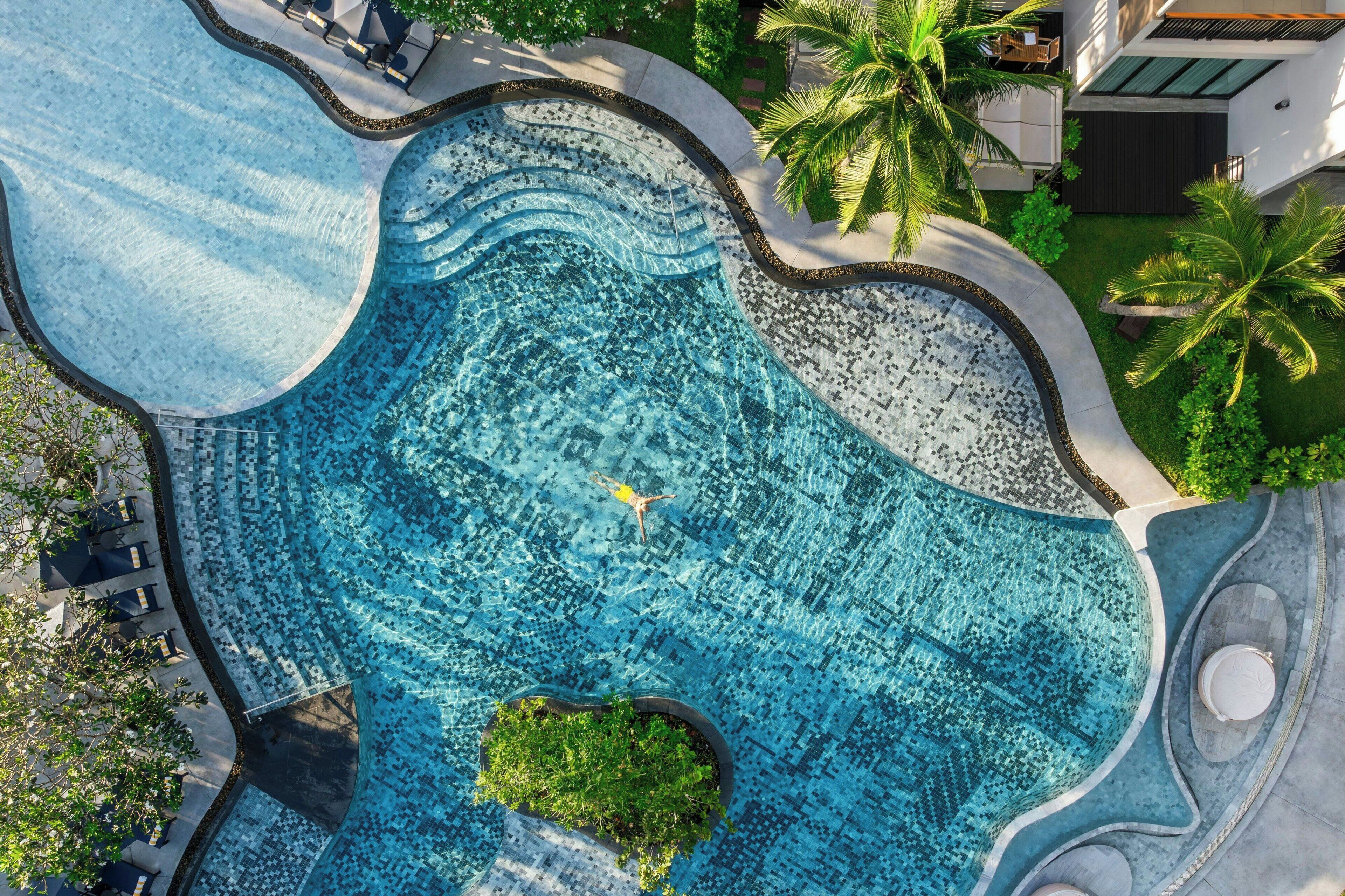 Outdoor pool, open 8:00 AM to 7:00 PM, pool umbrellas, pool loungers