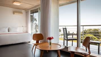 Suite, River View | Minibar, in-room safe, desk, blackout curtains