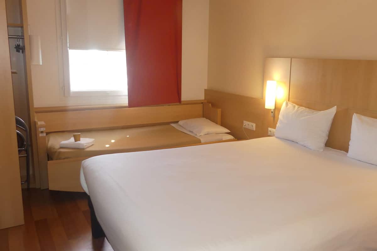 Standard Room, Multiple Beds | In-room safe, desk, soundproofing, iron/ironing board