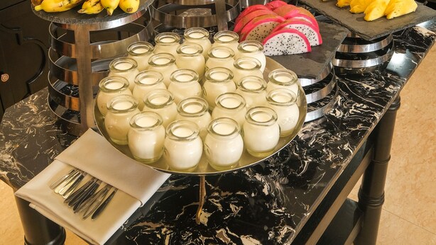 A buffet with various food items including fruits, pastries, and beverages. - Sanouva Saigon Hotel (Ho Chi Minh City)