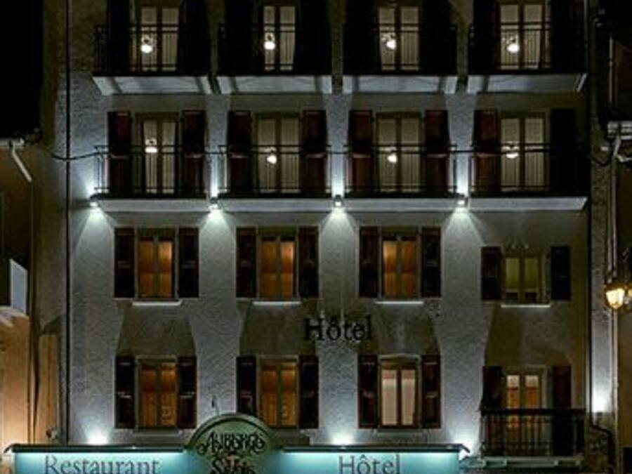 A hotel with a restaurant and bar at the ground level.
