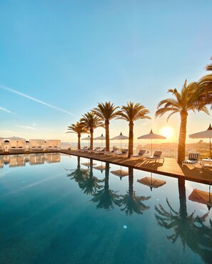 Seasonal outdoor pool, open 9:00 AM to 7:30 PM, pool umbrellas