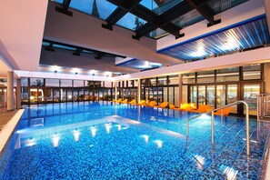 Seasonal outdoor pool, open 9 AM to 7 PM, pool umbrellas