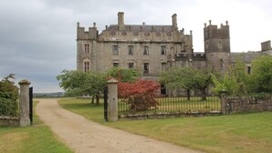 A large, historic stone building with multiple towers and a central entrance. - Seven Oaks Hotel with Heated Indoor Pool and Fitness Centre Carlow Town (Carlow)