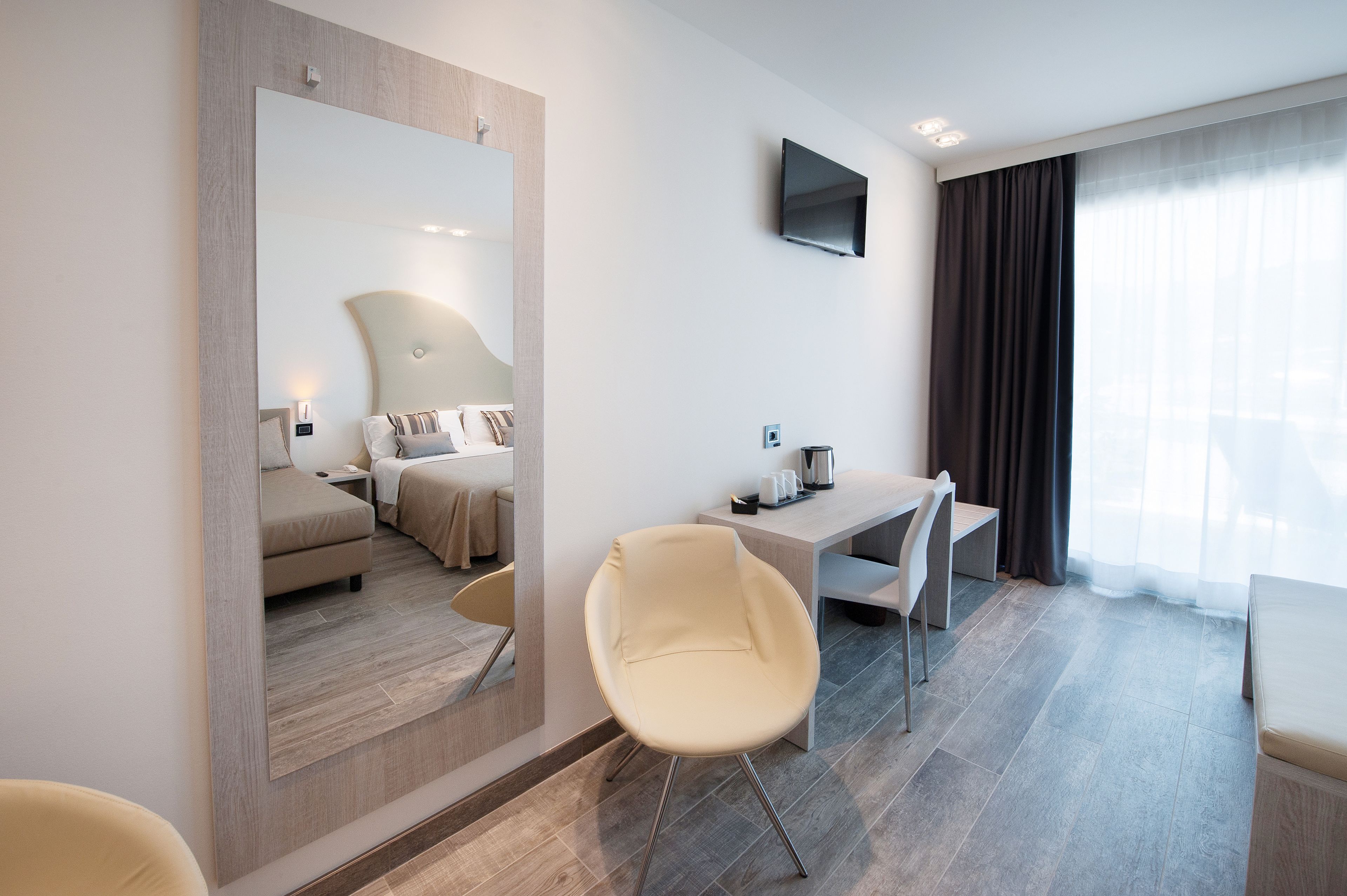 junior suite, lake view (triple) | living area | lcd tv