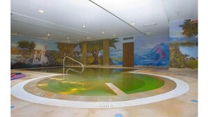 An indoor swimming pool with a mural on the wall depicting a natural landscape. - La Madonnina (Budduso)